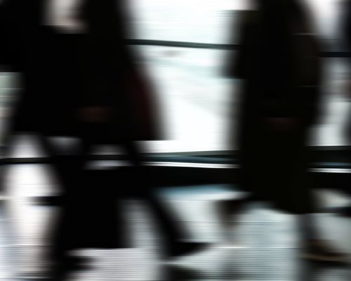 Abstract motion blur of a person exercising indoors
