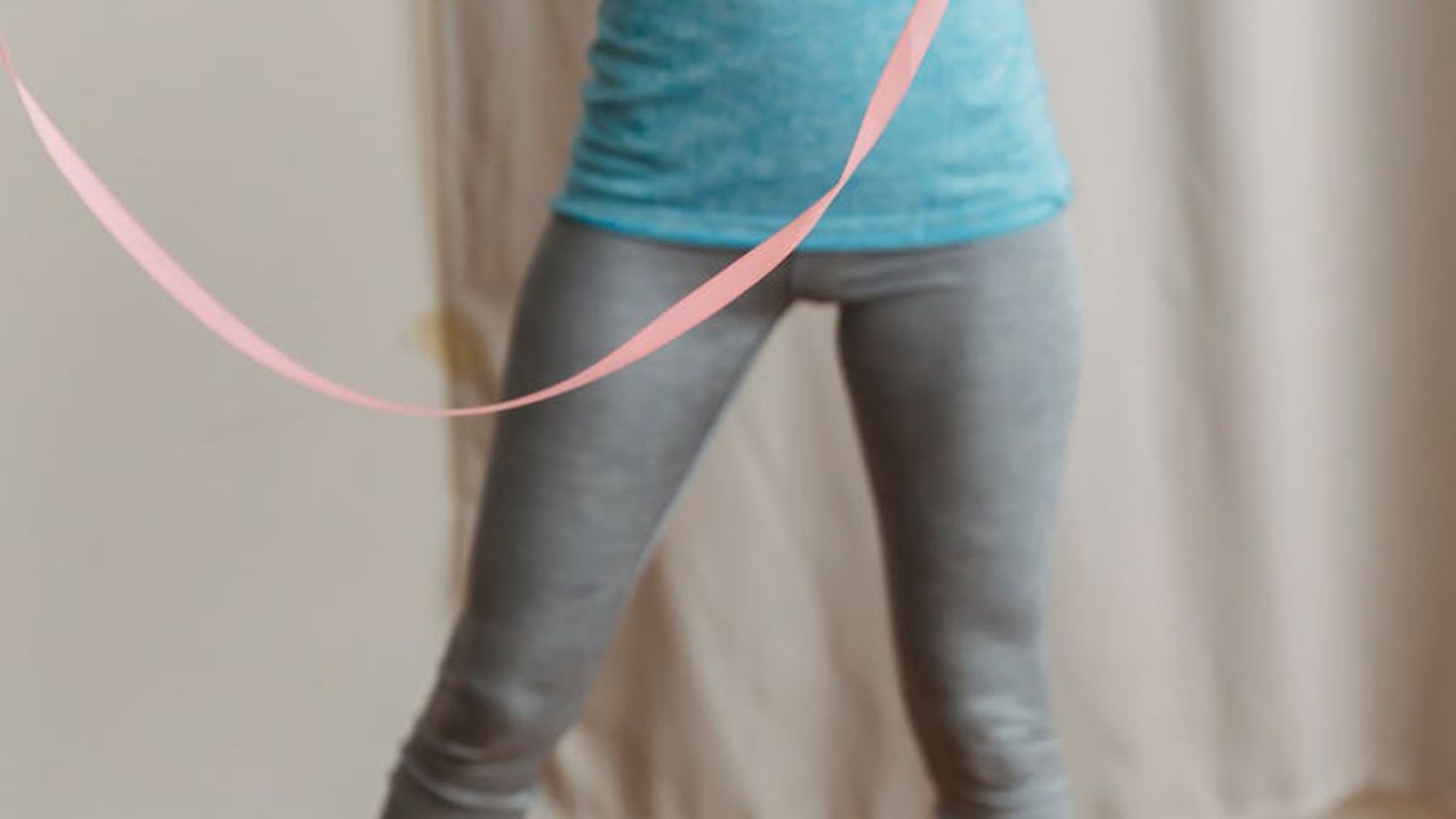 Active person moving rhythmically in a bright modern studio space